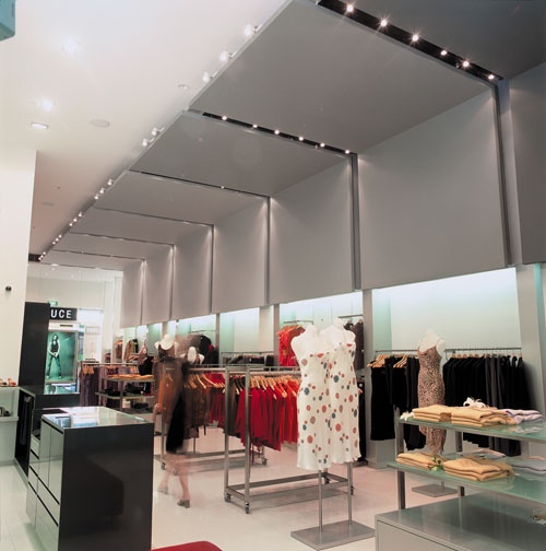 Women's clothing store with decorative coloured ceiling panels