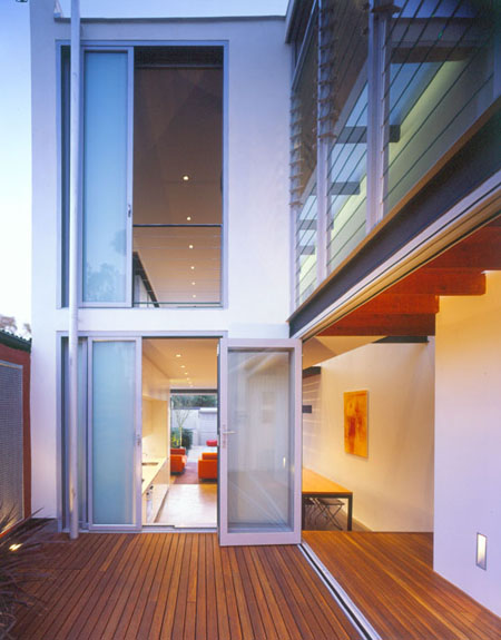 Modern architect designed house withaluminium bi-fold and sliding doors, two levels, central courtyard with timber decking