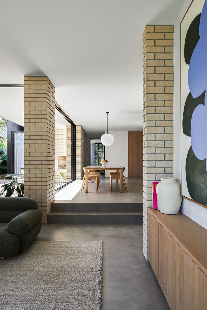 Modern architect designed house microcement floors, cream face brick walls