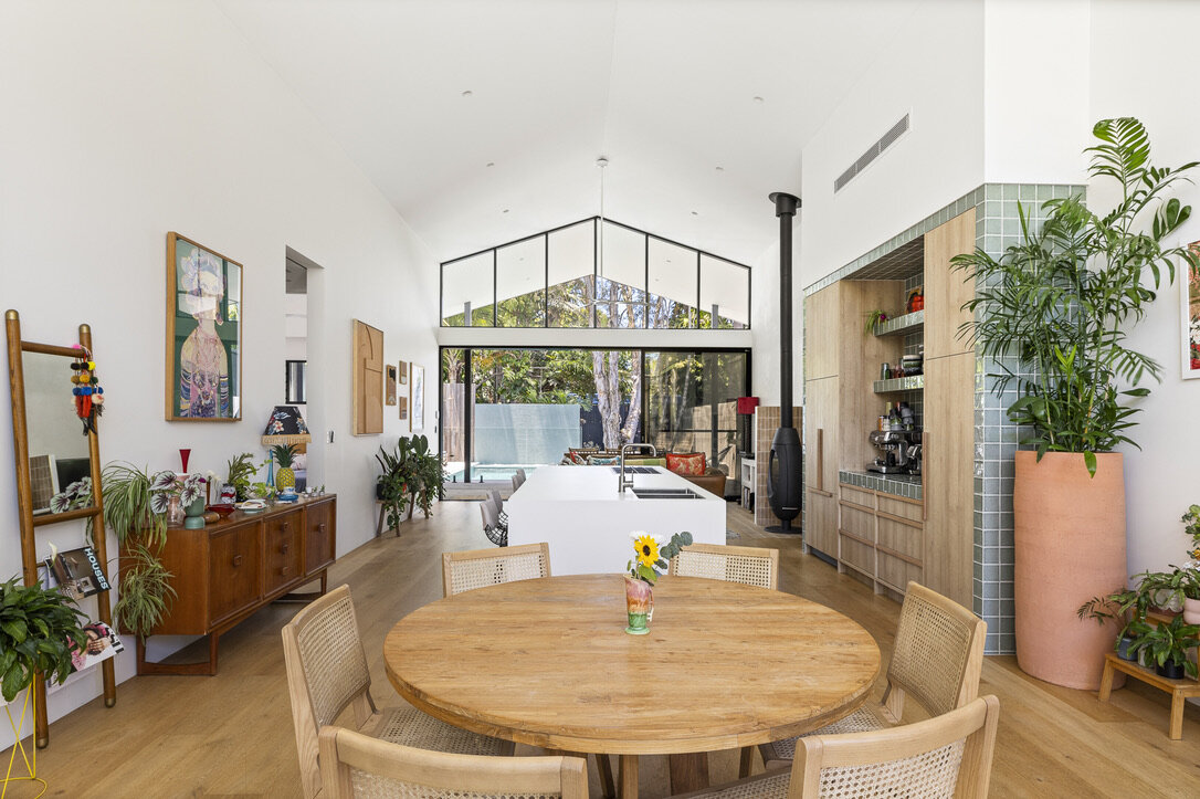 Raked ceiling, timber floors Living/dining/kitchen