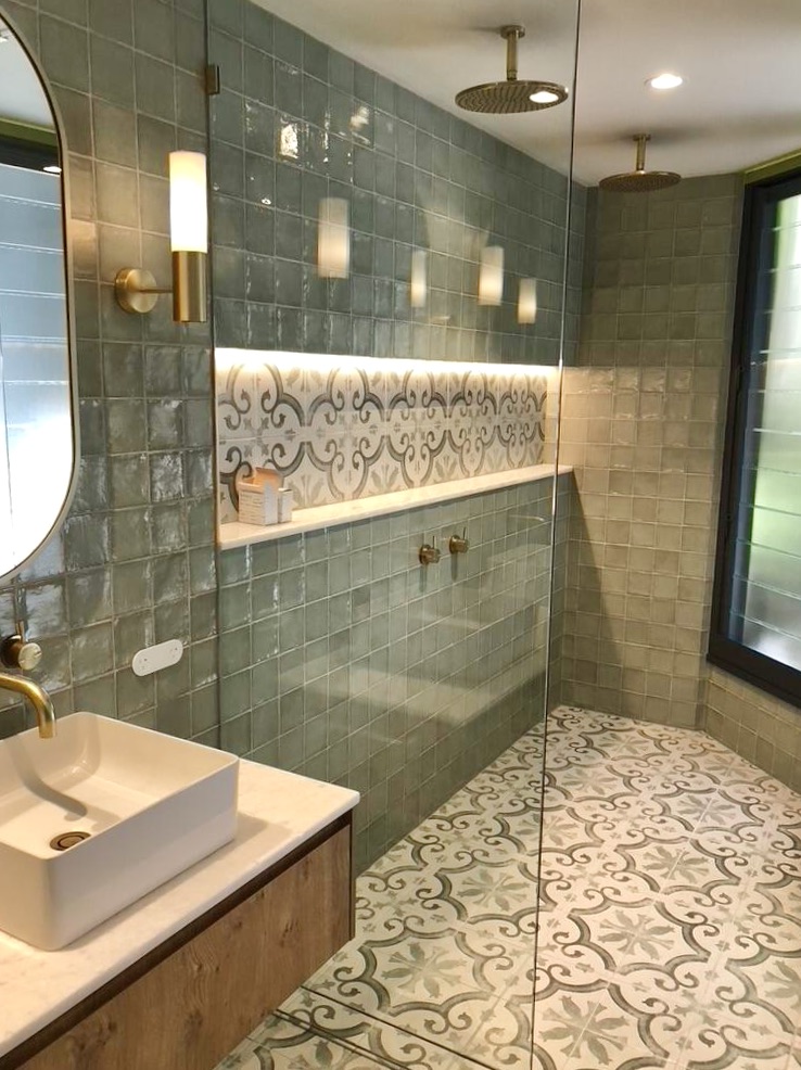 Modern architect designed bathroom refurbishment, green wall tiles, patterned floor tiles, shower niche with LED lighting