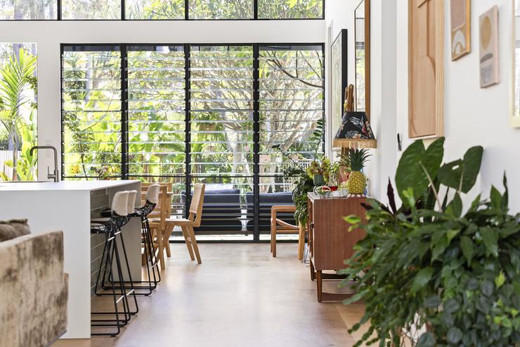 Modern architect desigend residence with concrete block wall with Porcelain benchtops glass louvre windows