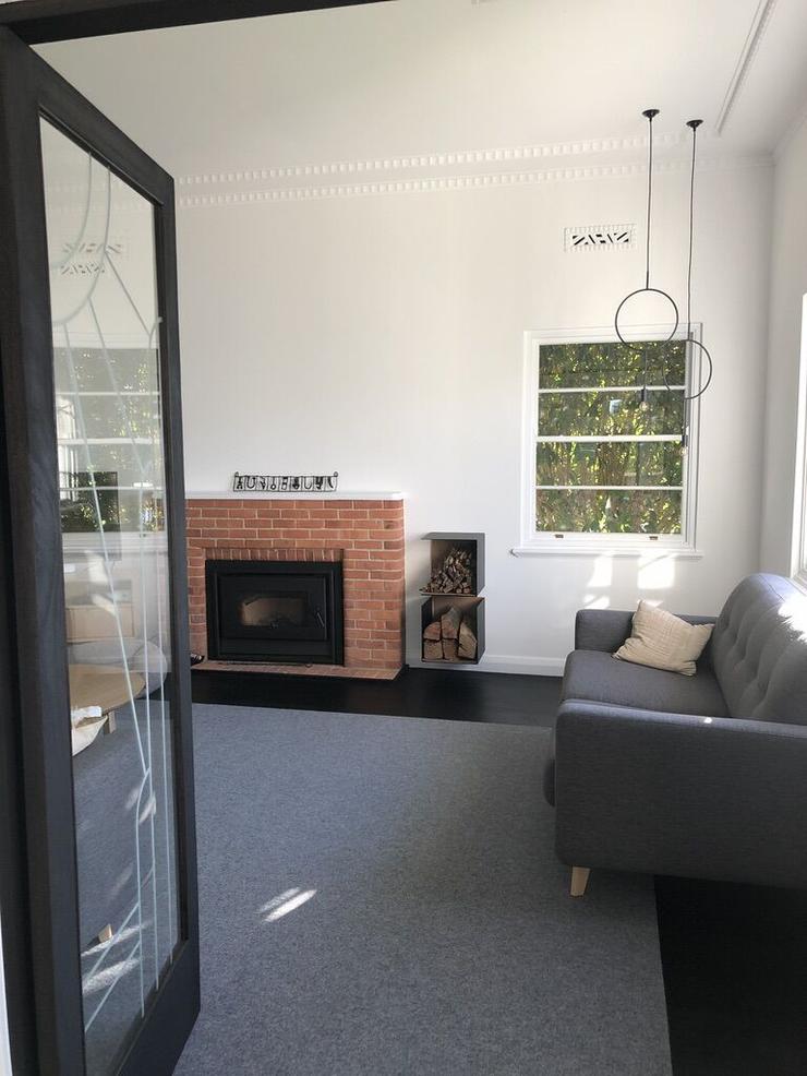 Architect designed renovations red brick fireplace black steel boxes